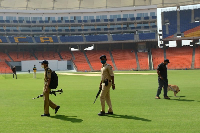Police personnel inspect the Narendra Modi Stadium, the world's biggest cricket stadium, ahead of the third Test between India and England. AFP