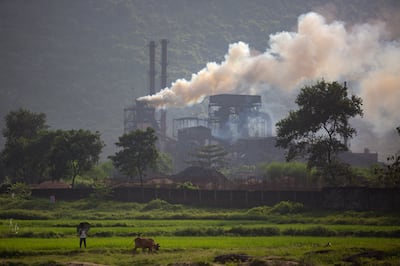 File photo: Smoke rises from a coal-powered steel plant at Hehal village near Ranchi, in India's eastern state of Jharkhand. AP