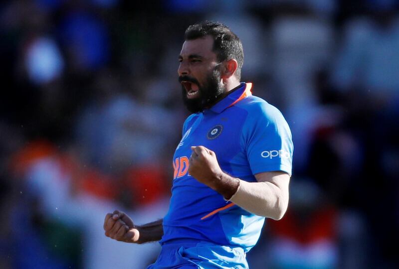 Cricket - ICC Cricket World Cup - India v Afghanistan - The Ageas Bowl, Southampton, Britain - June 22, 2019   India's Mohammed Shami celebrates taking the wicket of Afghanistan's Mujeeb Ur Rahman to complete a hat trick and win the match     Action Images via Reuters/Paul Childs