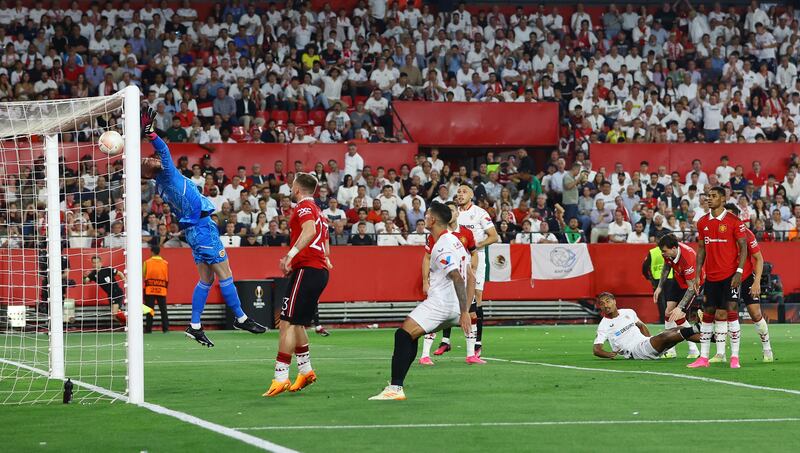 Sevilla's Loic Bade scores their second goal past Manchester United's David de Gea. Reuters