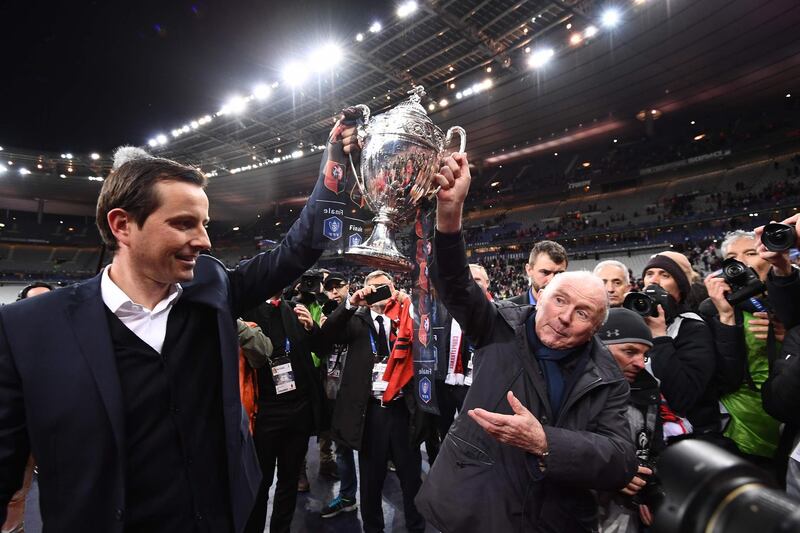 Rennes owner Francois Pinault, right celebrates with manager Julien Stephan after Rennes won the French Cup. Anne-Christine Poujoulat / AFP