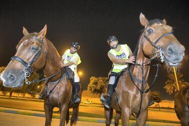 Sgt Mohammed Al Rashdi and Cpl Humaid Al Shamsi on their trusty steeds. Leslie Pableo for The National