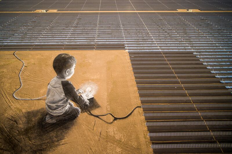 He describes this piece as a 'kind of magic', where the boy is depicted using the solar panels to light the bulb