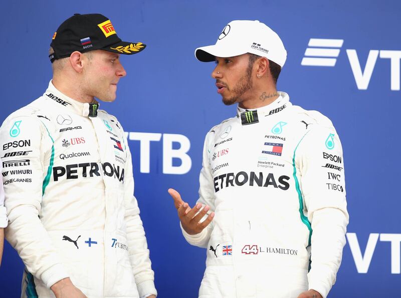 SOCHI, RUSSIA - SEPTEMBER 30:  Race winner Lewis Hamilton of Great Britain and Mercedes GP and second placed Valtteri Bottas of Finland and Mercedes GP look on, on the podium during the Formula One Grand Prix of Russia at Sochi Autodrom on September 30, 2018 in Sochi, Russia.  (Photo by Mark Thompson/Getty Images)