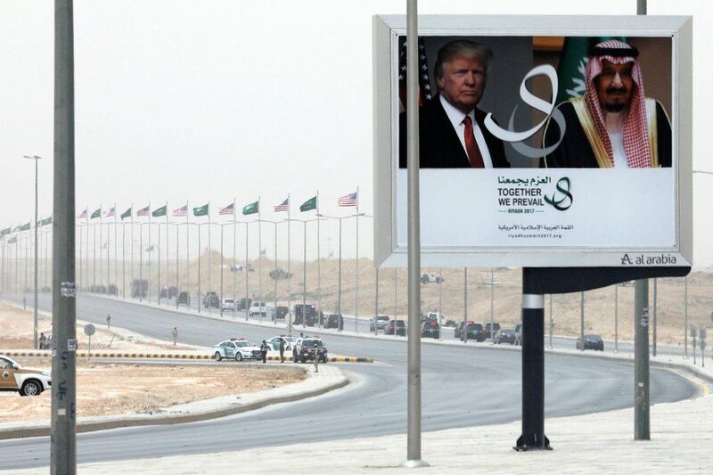Donald Trump’s motorcade passes a billboard advertising his visit to Saudi Arabia. Jonathan Ernst / Reuters