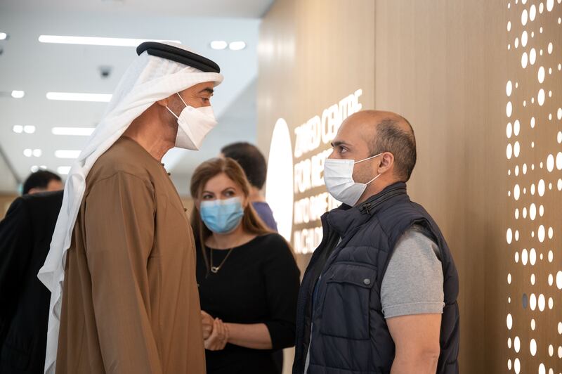 Sheikh Mohamed speaks with a family member of a patient at the centre.