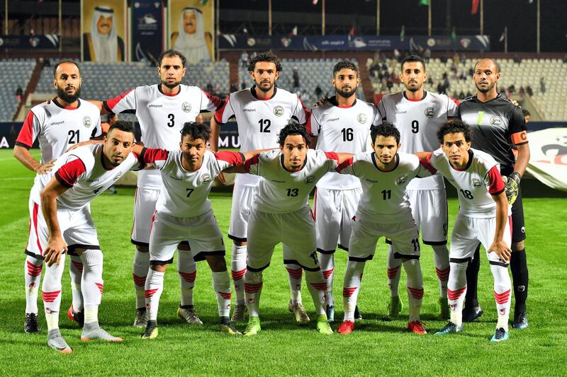 Yemen's national team football players pose for a group photo ahead of their 2017 Gulf Cup of Nations football match between Qatar and Yemen at the Sheikh Jaber al-Ahmad Stadium in Kuwait City on December 23, 2017. (Photo by GIUSEPPE CACACE / AFP)