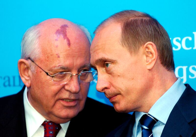 Gorbachev and Russian President Vladimir Putin before the start of a news conference in Schleswig, Germany, in December 2004. AP