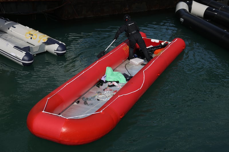 A border force officer parks a dingy used to carry migrants at Dover Port. Getty Images