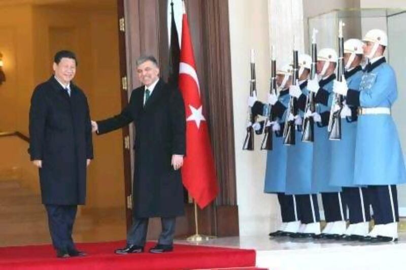 Analysts say a recent visit to Ankara by China’s vice-president, Xi Jingping, left, and seeking Arab investors are signs of a confident Turkey looking for new partners outside of Europe.