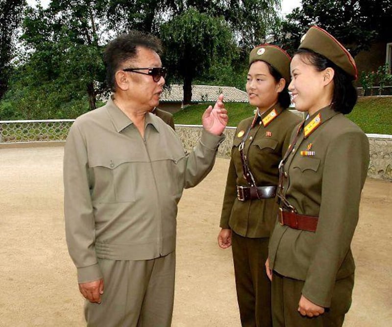 In this undated photo, the North Korean leader Kim Jong Il chats with female soldiers.