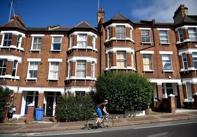 epa08520154 (FILE) - A woman cycles up a residential street in south-west London, Britain, 22 August 2016 (reissued 01 July 2020). Nationawide Building Society, world's largest building society on 01 July 2020 said the annual house price growth in UK has come to a halt in June 2020 with prices down 0.1 per cent due to Covid-19, coronavirus impact on the housing market. Nationwide also said the annual growth was negative for first time since 2012, while after taking account of seasonal factors the prices fell 1.4 per cent month-on-month.  EPA/HANNAH MCKAY *** Local Caption *** 52981251
