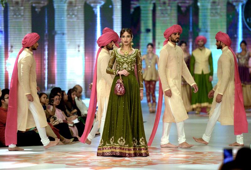 Models present creations by Pakistani designer Zaheer Abbas. Rizwan Tabassum / AFP photo