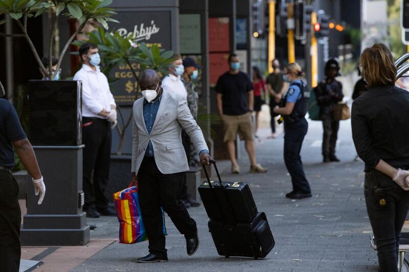 An international passenger is seen arriving to a Covid-19 quarantine hotel in Perth, Australia. Getty Images