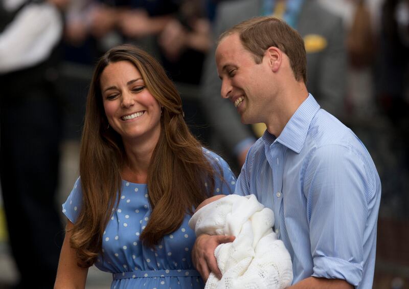 Britain's Prince William and Kate, Duchess of Cambridge react as they talk to the media whilst holding the Prince of Cambridge, Tuesday July 23, 2013, after posing for photographers outside St. Mary's Hospital exclusive Lindo Wing in London where the Duchess gave birth on Monday July 22. The Royal couple are expected to head to London’s Kensington Palace from the hospital with their newly born son, the third in line to the British throne.  (AP Photo/Matt Dunham) *** Local Caption ***  Britain Royal Baby.JPEG-02d84.jpg