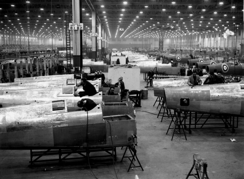 Workers in the assembly area of an aircraft factory in the Midlands, building Spitfires in 1941. Getty Images
