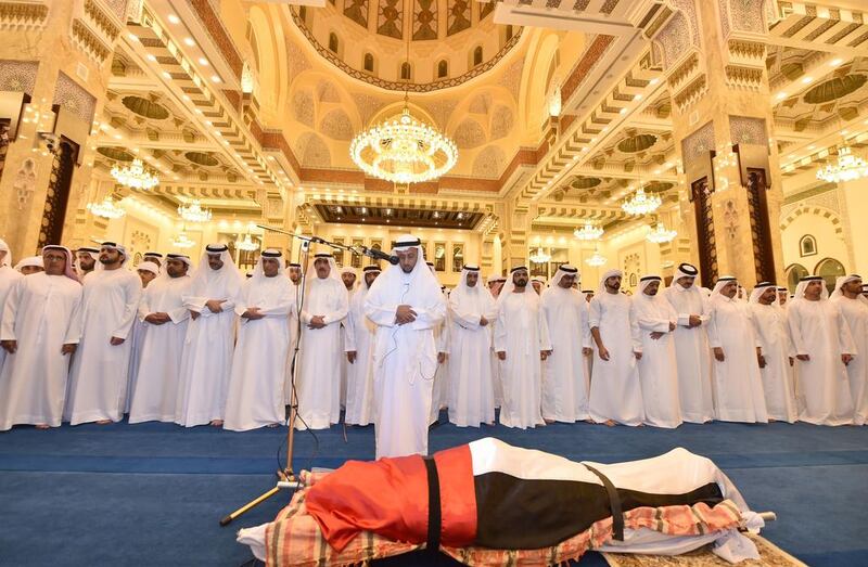 UAE leaders pray over the body of Sheikh Rashid bin Mohammed on September 19, 2015. Wam