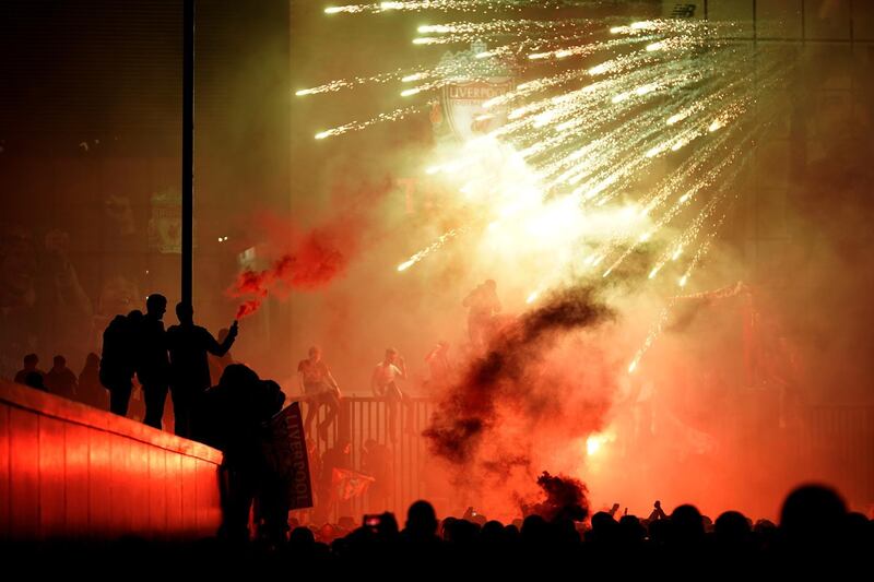 Liverpool fans celebrate outside Anfield stadium. Getty