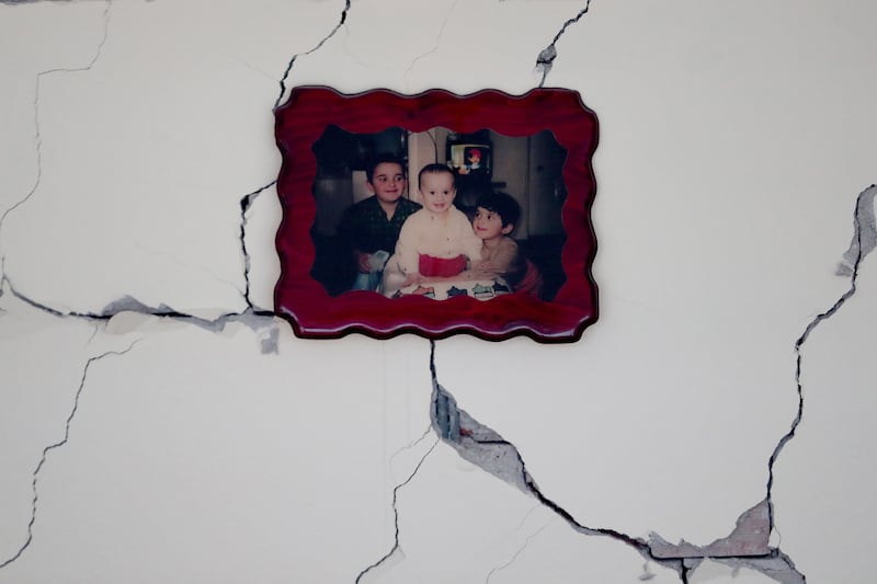 A framed picture on the cracked wall of a collapsed building in Kahramanmaras, south-eastern Turkey. EPA