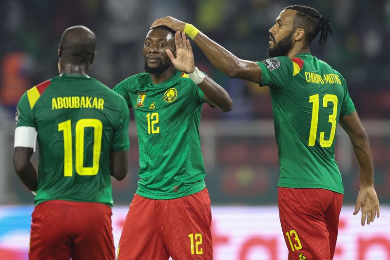 Cameroon forward Karl Toko Ekambi celebrates with Vincent Aboubakar and Eric Choupo Moting after scoring his team's first goal. AFP