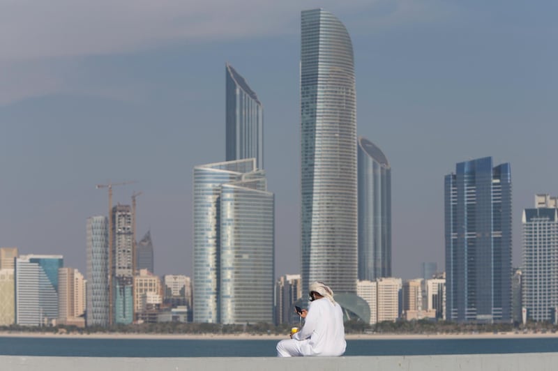 Abu Dhabi, United Arab Emirates, February 8, 2017:    An Emirati man uses his smartphone while drinking coffee on the breakwater along the corniche in Abu Dhabi on February 8, 2017. Christopher Pike / The National

Job ID: 
Reporter:  N/A
Section: News
Keywords: possible focal point *** Local Caption ***  CP0208-Na-standalone-03.JPG