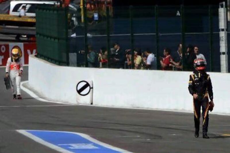 Romain Grojean, left, and Lewis Hamilton both had tough weekends at Spa.