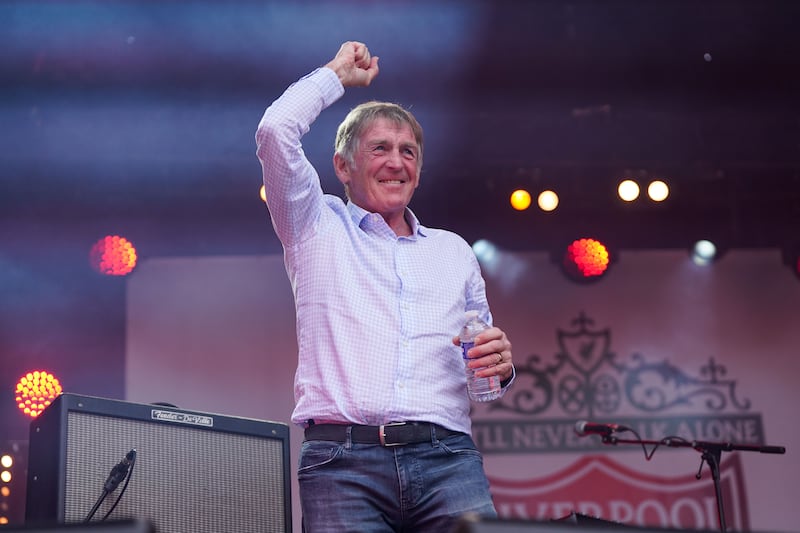 Sir Kenny Dalglish greets Liverpool supporters in a fan zone in Paris. PA