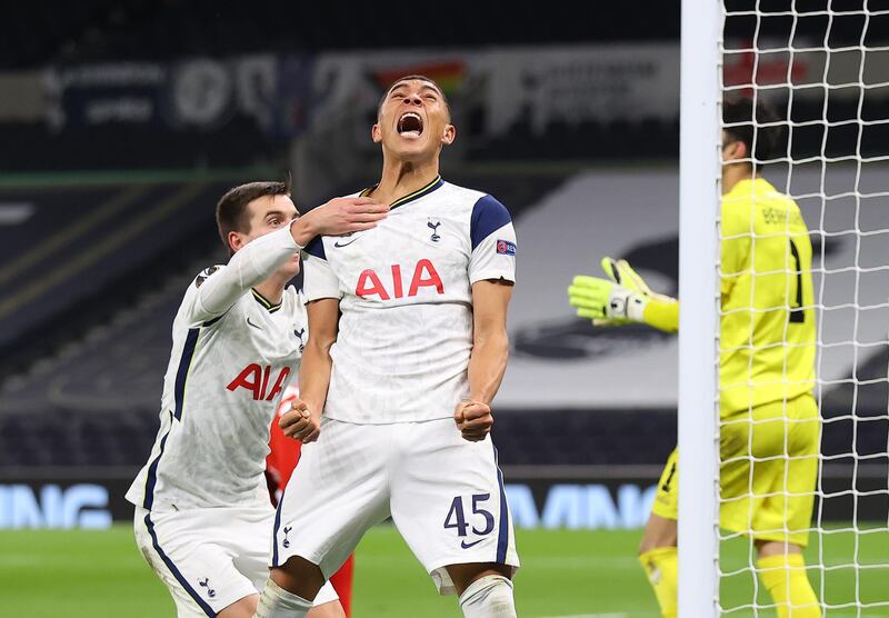 LONDON, ENGLAND - DECEMBER 10: Carlos Vinicius of Tottenham Hotspur celebrates with Giovani Lo Celso of Tottenham Hotspur after scoring his sides 1st goal after scoring their team's first goal  during the UEFA Europa League Group J stage match between Tottenham Hotspur and Royal Antwerp at Tottenham Hotspur Stadium on December 10, 2020 in London, England. A limited number of fans (2000) are welcomed back to stadiums to watch elite football across England. This was following easing of restrictions on spectators in tiers one and two areas only. (Photo by Julian Finney/Getty Images)