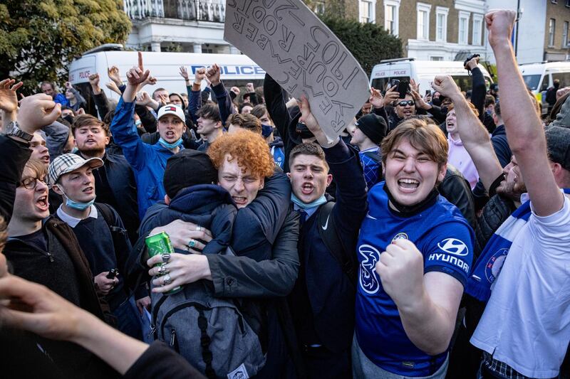Fans celebrate outside  Stamford Bridge after it was announced that Chelsea would withdraw from the new European Super League. Getty