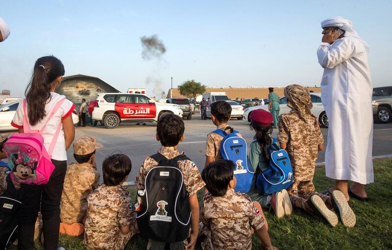 FUJAIRAH, UNITED ARAB EMIRATES - Kids with their military costume watching from the street of  the Fourth Union Fortress, Fujairah.  Leslie Pableo for The National for Ruba Haza���s story