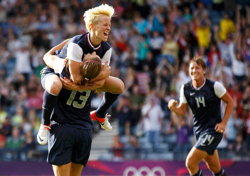 REFILE - ADDITIONAL INFORMATION
Alex Morgan (13) of the U.S. celebrates with team mate Megan Rapinoe (top) after scoring her second, and the fourth goal for the U.S against France during their women's Group G football match at the London 2012 Olympic Games at Hampden Park in Glasgow, Scotland July 25, 2012. The U.S. beat France 4-2.  REUTERS/David Moir (BRITAIN  - Tags: SPORT OLYMPICS SPORT SOCCER TPX IMAGES OF THE DAY) *** Local Caption ***  OLYDN121_OLY-SOCC-F_0725_11.JPG