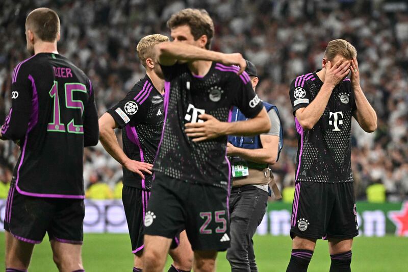 Thomas Muller, Harry Kane and Bayern teammates after their defeat to Real Madrid. AFP
