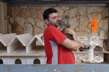 Alaa Aljaleel with a displaced feline. Getty 