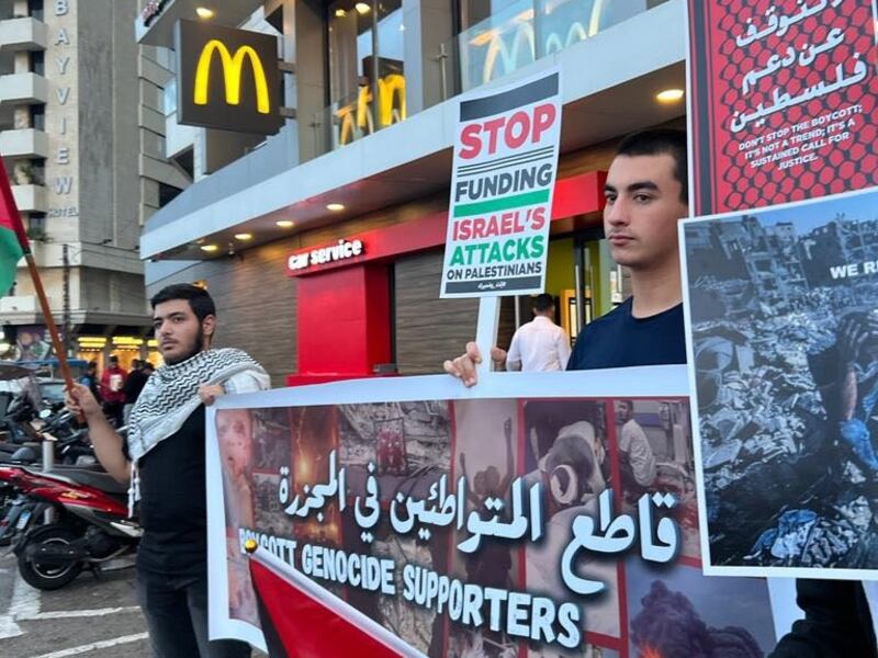 Activists stage a protest calling for a boycott of companies that support Israel outside the McDonald's in Beirut's Aein Mrayse. Photo: Abbas Atout.