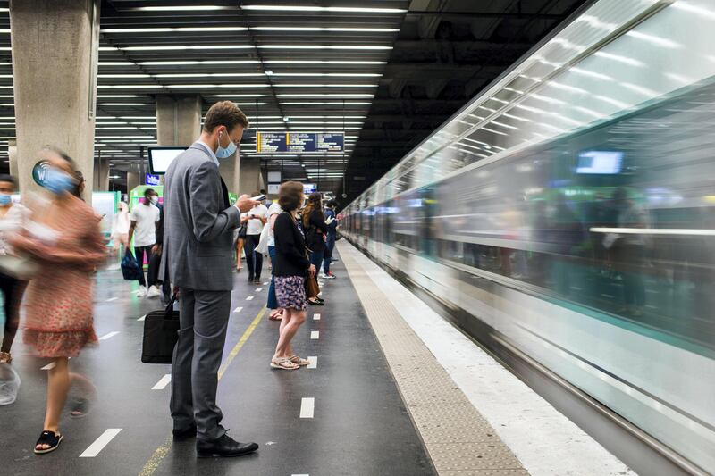 Morning commuters wearing protective face masks wait to board a train at the underground metro railway station in the La Defense business district in Paris, France, on Wednesday, June 9, 2021. Talks with labor unions are underway for a broad framework agreement on working from home, l’Obs reported, citing an interview with Labor Minister Elisabeth Borne. Photographer: Nathan Laine/Bloomberg