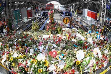 TA picture taken on August 5, 2019 at Frankfurt am Main's central stration shows flowers that people left to pay tribute to an eight-year-old boy who died after he was pushed under a train a week earlier. The horrific crime has dominated newspaper front-pages and TV news bulletins, and led politicians to call for heightened security, more camera surveillance and tighter border controls. AFP