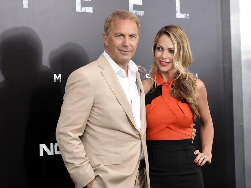 Actor Kevin Costner, left, and wife Christine Baumgartner attend the "Man Of Steel" world premiere at Alice Tully Hall on Monday, June 10, 2013 in New York. (Photo by Evan Agostini/Invision/AP) *** Local Caption ***  World Premiere Man Of Steel.JPEG-095ef.jpg