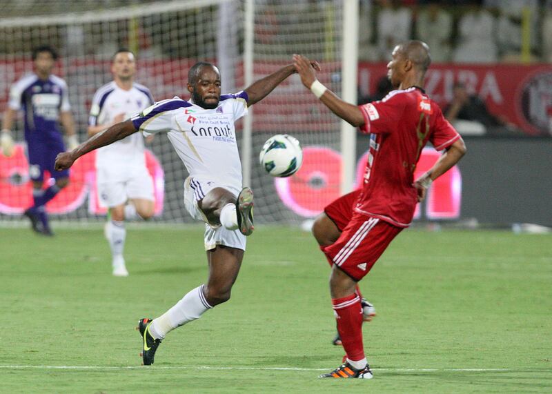 Dubai, United Arab Emirates, Sep 17, 2012 -  Yaser Matar (right)from Al Jazira fight for the ball with Jires Kembo - Ekoko (left)from Al Ain during the  Super Cup final match at Al Wasl Sports Club.  ( Jaime Puebla / The National Newspaper )