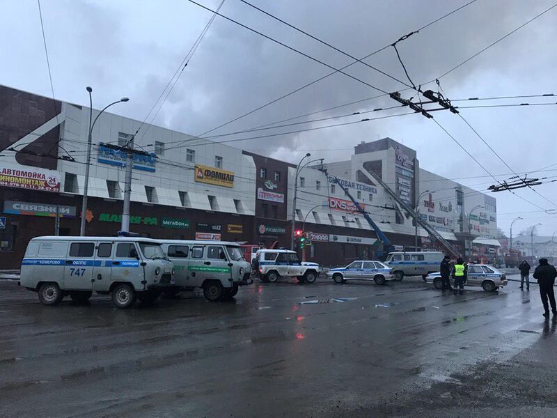 Rescue personnel is seen on a site of fire at a shopping mall in Kemerovo, Russia. Dmitry Saturin / Reuters