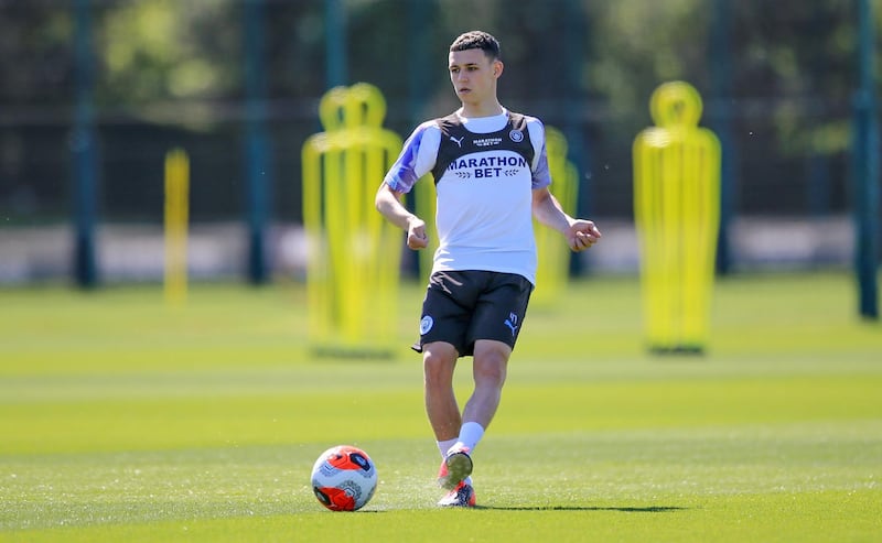 MANCHESTER, ENGLAND - MAY 25: Manchester City's Phil Foden in action during training at Manchester City Football Academy on May 25, 2020 in Manchester, England. (Photo by Tom Flathers/Manchester City FC via Getty Images)