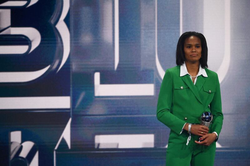 France and Olympique Lyonnais defender Wendie Renard  receives and award for the Fifa Fifpro Women's World 11. AFP