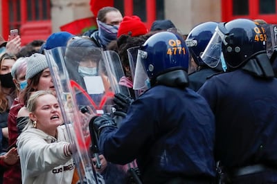 Police officers control the crowd during a protest against a new proposed policing bill, in Bristol, Britain, March 21, 2021. REUTERS/Peter Cziborra