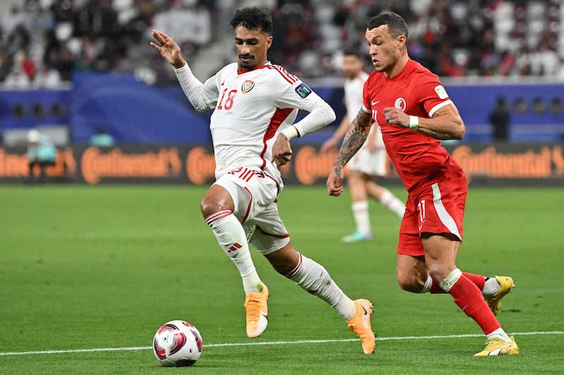 Hong Kong's forward Everton Camargo fights for the ball with UAE's midfielder Abdullah Ramadan. AFP