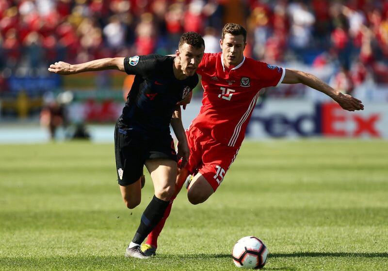 Soccer Football - Euro 2020 Qualifier - Group E - Croatia v Wales - Stadion Gradski vrt, Osijek, Croatia - June 8, 2019  Croatia's Ivan Perisic in action with Wales' Jamie Lawrence    REUTERS/Antonio Bronic