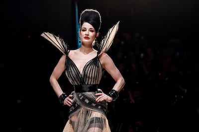 TOPSHOT - US actress Dita Von Teese presents a creation by Jean-Paul Gaultier during the 2019 Spring-Summer Haute Couture collection fashion show in Paris, on January 23, 2019. / AFP / ALAIN JOCARD
