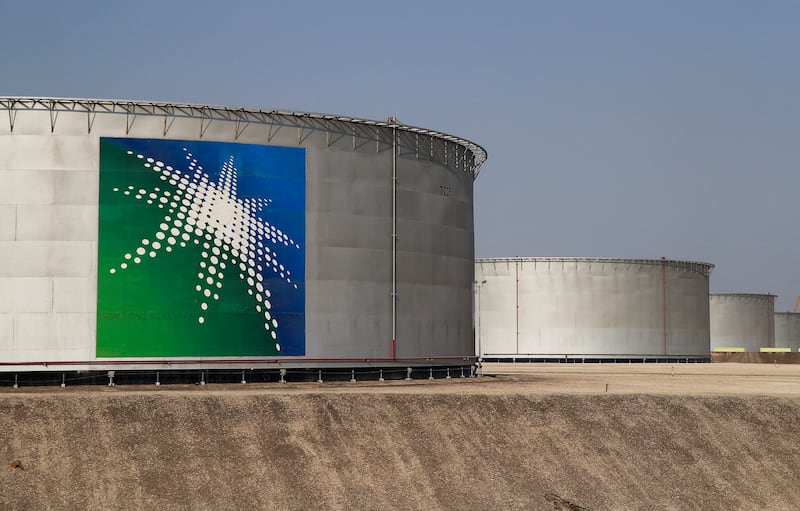Branded oil tanks at a Saudi Aramco oil facility in Abqaiq, Saudi Arabia. Reuters