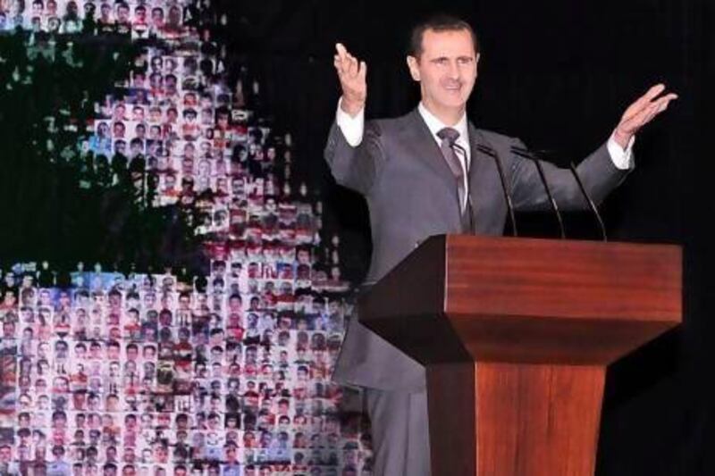 Syrian president Bashar Al Assad delivered his speech in front of a Syrian flag made of pictures of people allegedly killed during the uprising. “They (his opponents) are the enemies of the people and the enemies of God. The enemies of God will go to hell,” he said.