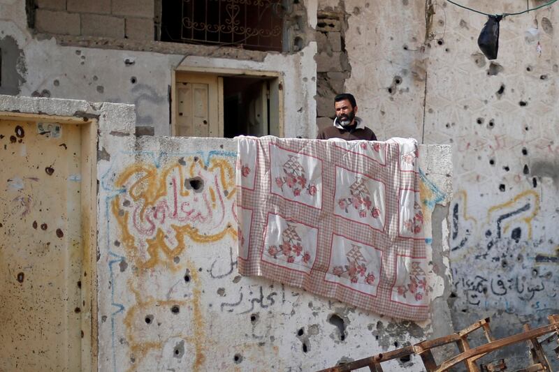 A Palestinian man looks out of his house in the northern Gaza Strip. Reuters