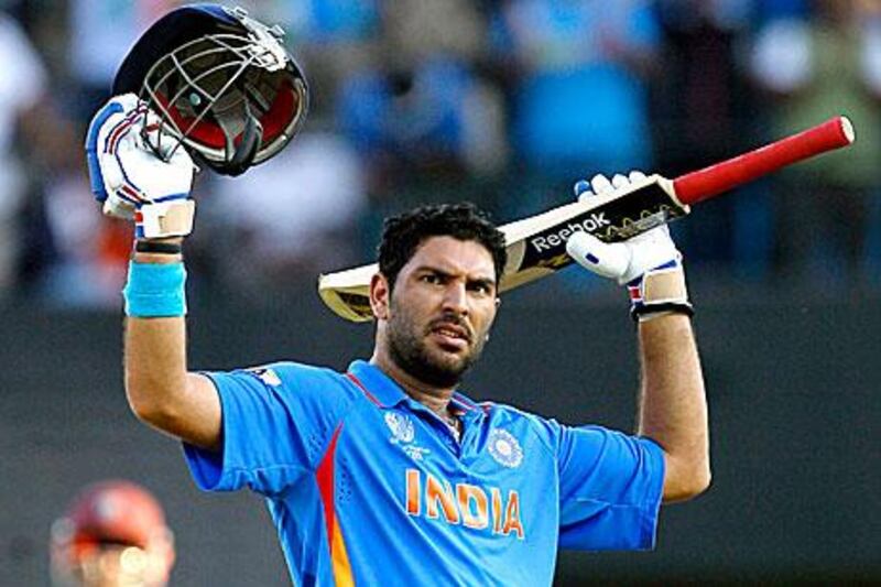 India's Yuvraj Singh celebrates his century against West Indies in Chennai. Kirsty Wigglesworth / AP Photo