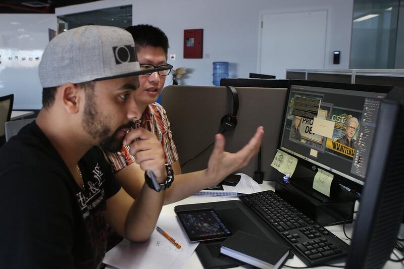 Xie Jun and Hicham Habchi work on the CSI: Las Vegas game at the Ubisoft Abu Dhabi Studio.